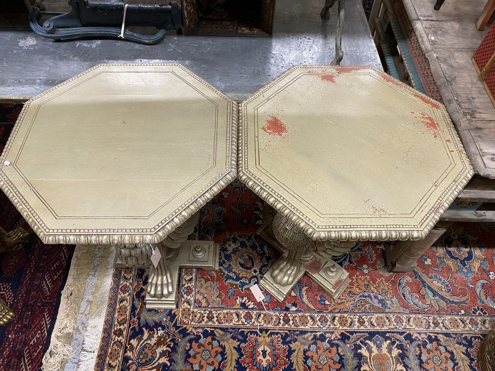 A pair of Empire style octagonal wooden centre tables with winged griffin supports, width 60cm, height 82cm